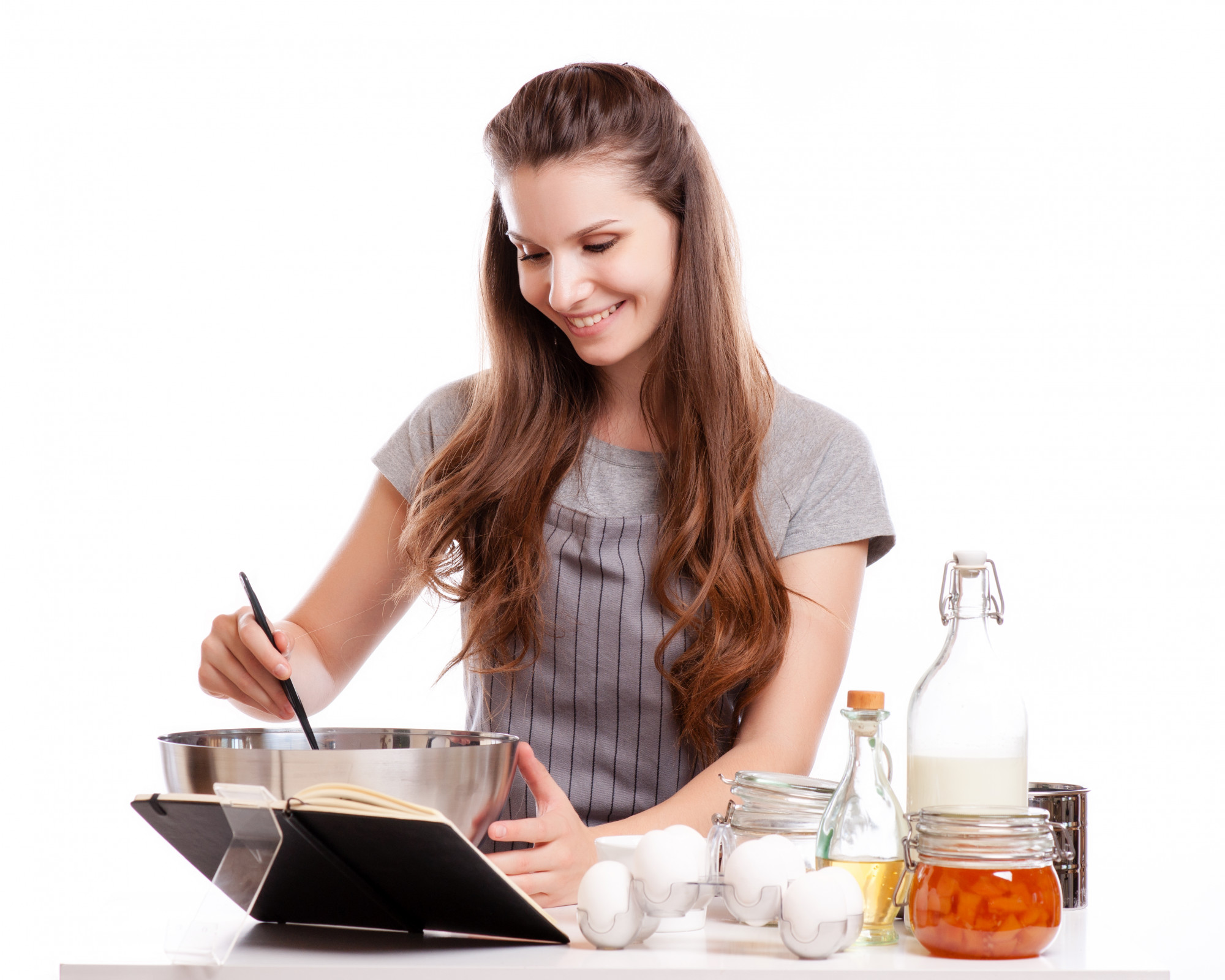 Student cooking at home following online lesson